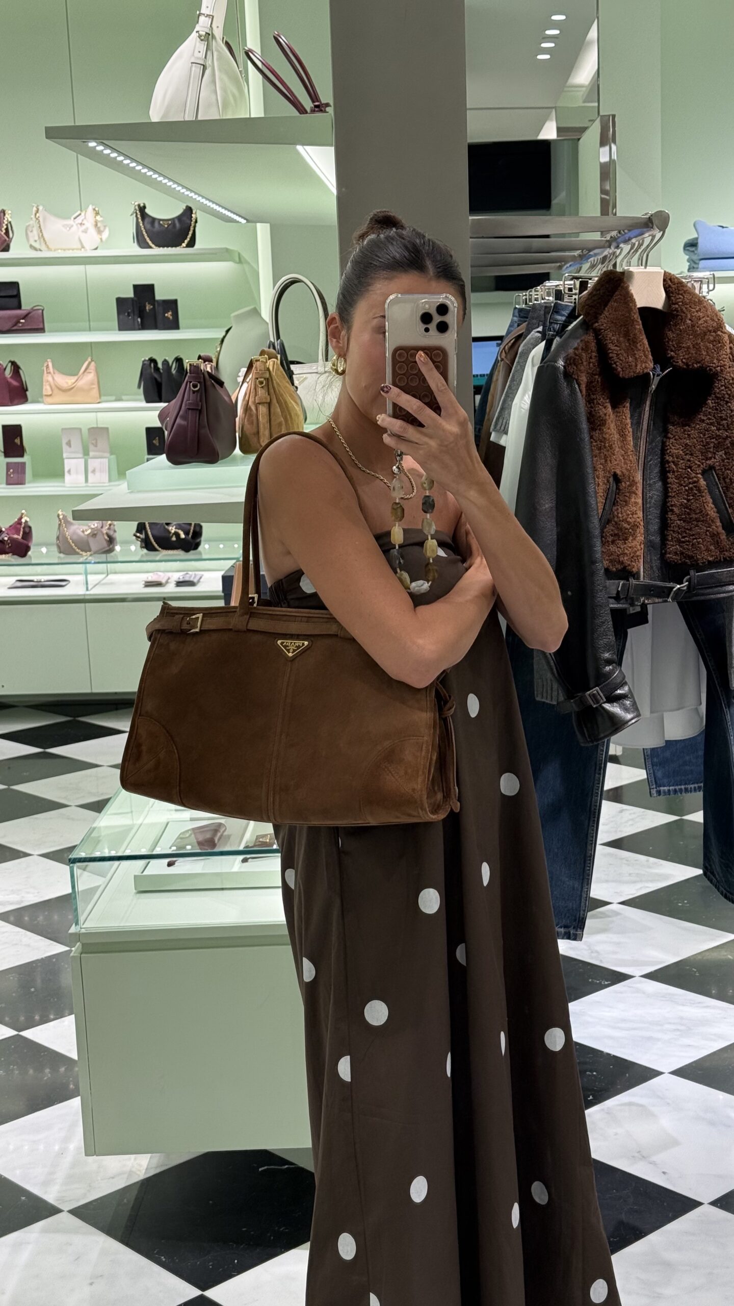 Christine Andrew's new brown suede Prada bag