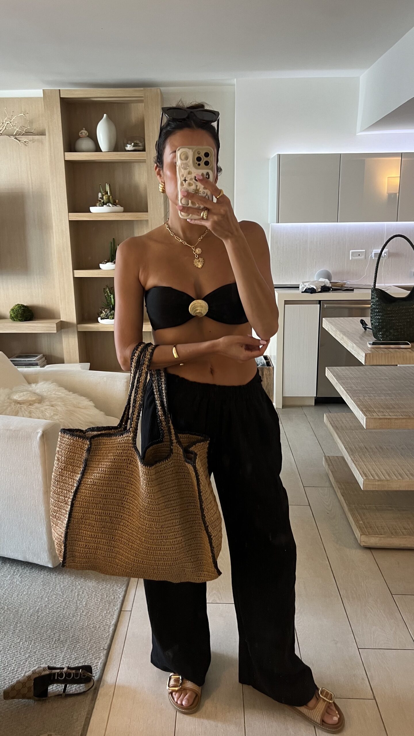 Christine Andrew in a black affordable beach vacation outfit